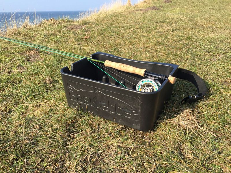 BasKette with rod and reel on the grass
